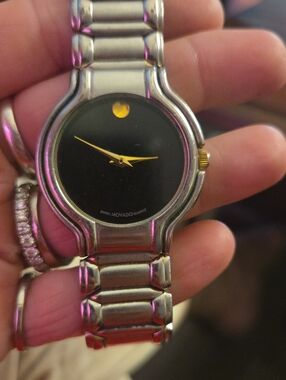 Movado Black Dial Watch with Gold Hands and Dot